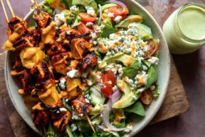Spring Chopped Buffalo Chicken Skewer Salad.